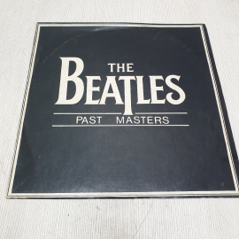  Виниловая пластинка Beatles. 